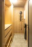 Small, floor heated room by the entrance hall to hang up clothes, dry shoes, mittens et.