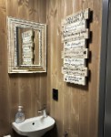 Separate toilet with sink.