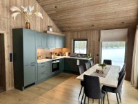 Well equipped kitchen and big dining table.